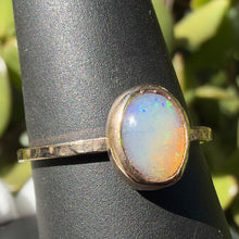 Load image into Gallery viewer, Opal ring, angled view showing the gold filled bezel and hammered band