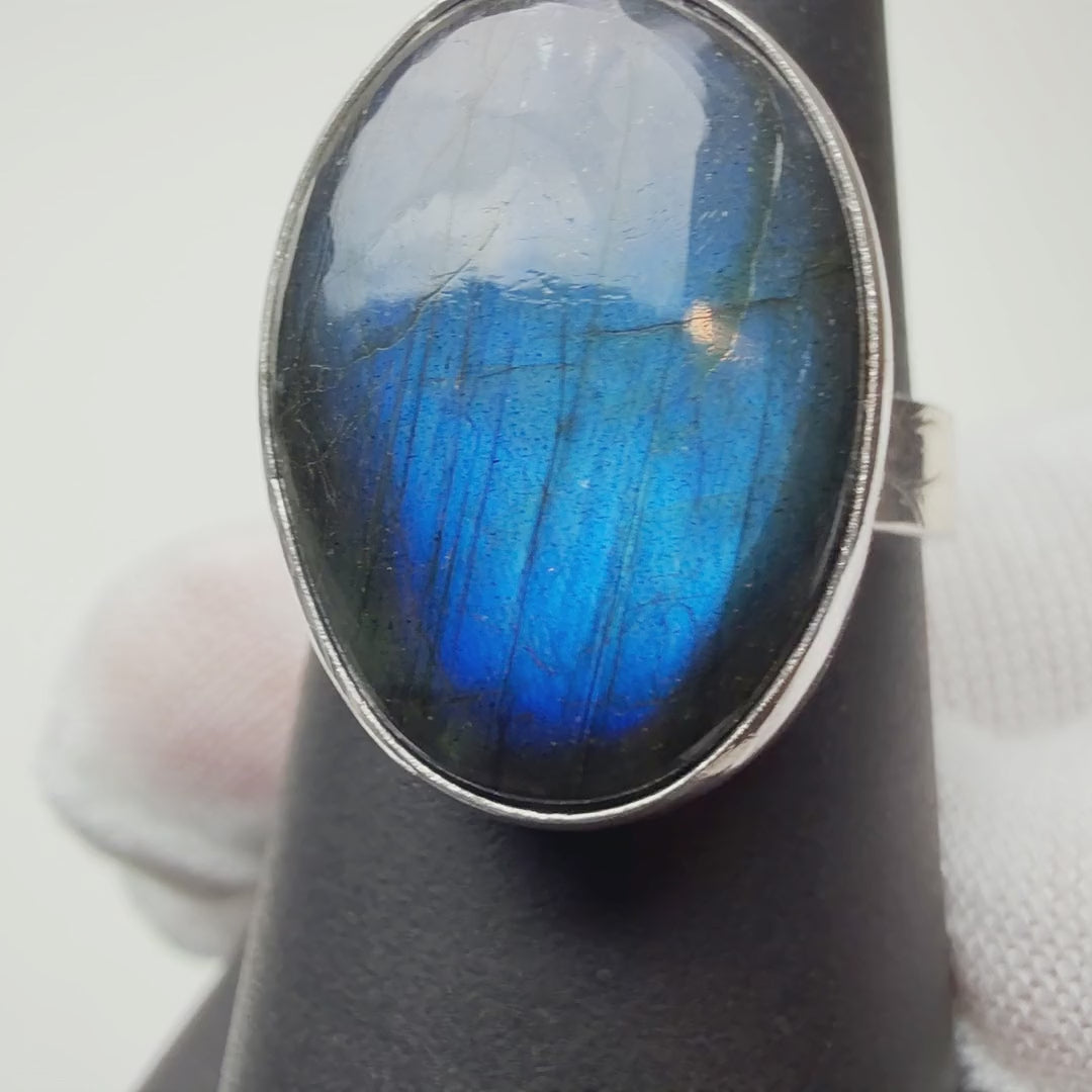 Blue Oval Labradorite ring turning on a ring display