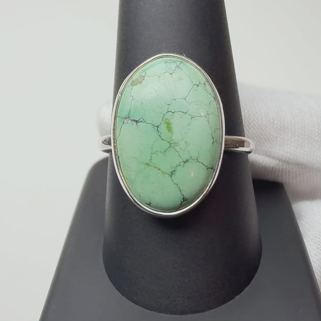 Turquoise ring turning on a ring display