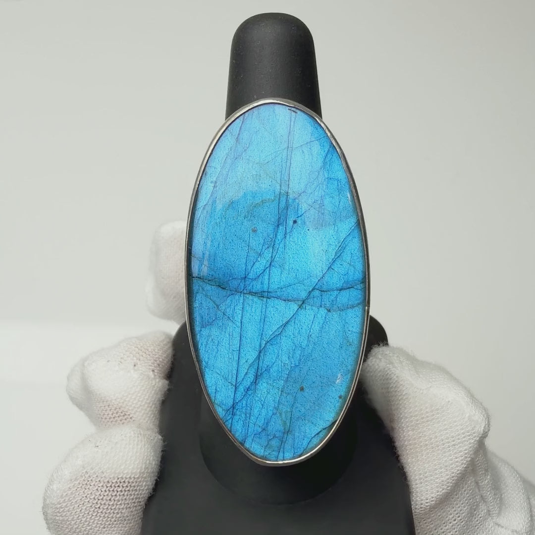 Labradorite ring turning on a ring display