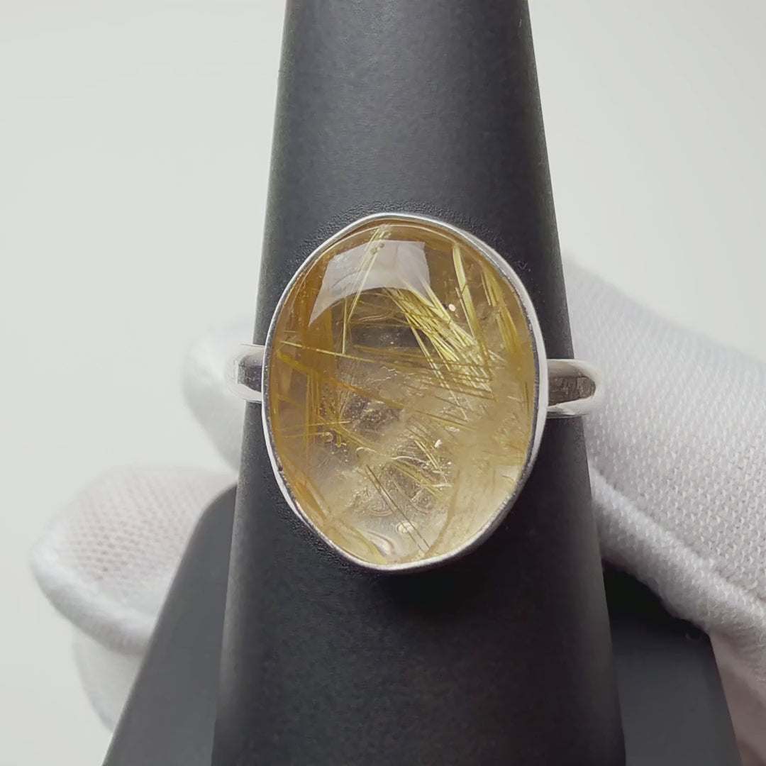 Rutilated Quartz ring turning on a ring display