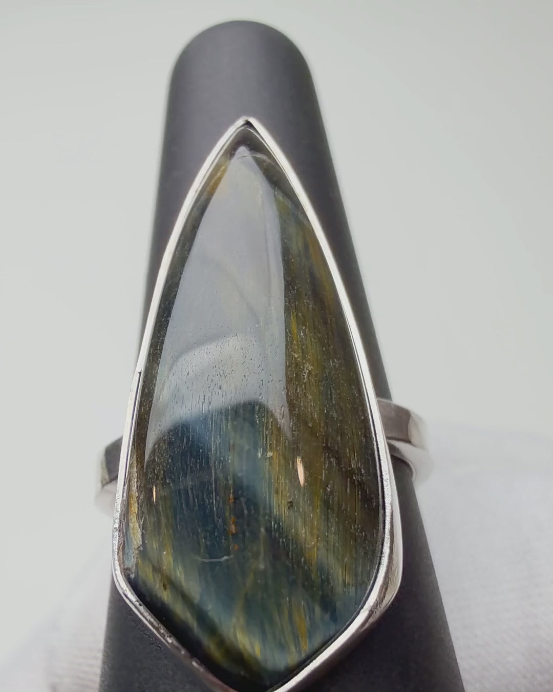 Kite Shaped Tiger's Eye ring turning on a ring display