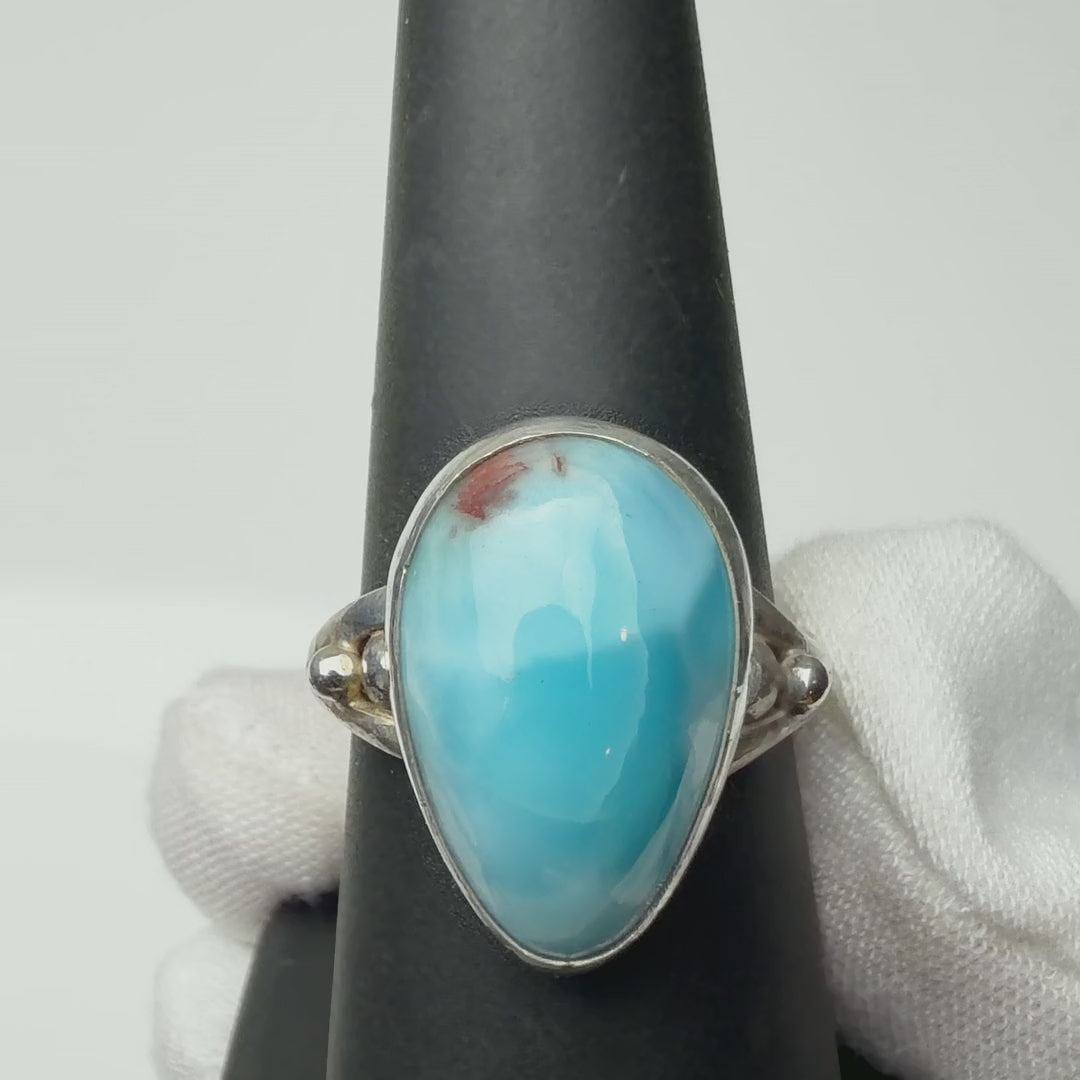 Larimar ring turning on a ring display