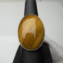 Load image into Gallery viewer, Tiger's eye ring in sterling silver, size 7.5, front view showing the golden banded stone